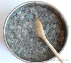 a wooden spoon in a pot full of rocks