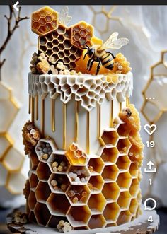 the cake is decorated with honeycombs and bees