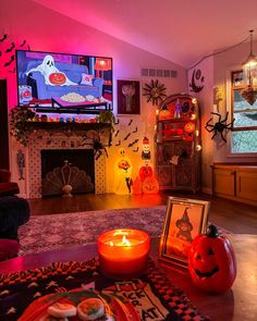 a living room decorated for halloween with candles and decorations