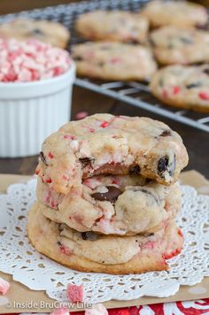 three cookies stacked on top of each other with pink and white sprinkles