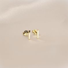 Simple Bar Stud Earrings- This listing is for a pair of the Bar Stud Earring. A perfect everyday piece to be worn alone or great layered with each other.- Base Material: High Quality Solid 925 Sterling Silver- Finish: 18K Gold or Rhodium- Measurement: 6mm - Nickel Free- All our jewelry is packaged in gift ready boxes. If you would like multiple items from your order packaged separately please let us know!© 2023 Generation of Daughters Lingot D'or, Gold Bar Earrings Studs, Bar Stud Earrings, Bar Studs, Stud Jewelry, Earrings Dainty, Gold Bar, La Jolla, Stud Earring