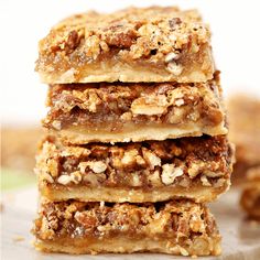 three pieces of pecan bar stacked on top of each other