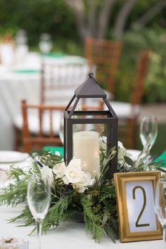 the table is set with candles and flowers