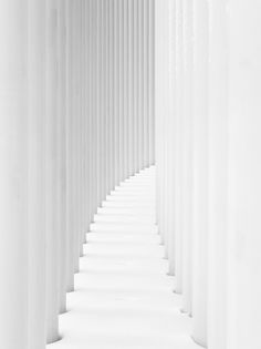 white columns are lined up in a long row