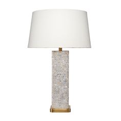 a table lamp with a white shade on it