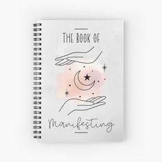 a spiral notebook with the words, the book of marketing written on it and two hands holding