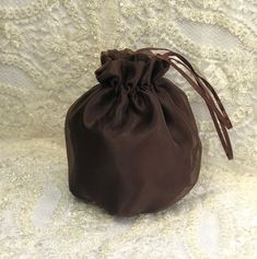 Elegant satin organza bag / money bag / purse ! Ideal for your wedding day, night out, party ,special occasion Color: bronze brown chocolate You can choose any other color Fabric : satin / organza Lining : poliester Closes and opens due to elastic , very comfortable for aduls and and children. Size : approx. 18 cm x 18 cm We accept credit cards! Rectangular Brown Pouch For Gift, Brown Pouch Evening Bag As Gift, Elegant Brown Evening Bag, Brown Bag With Dust Bag As A Gift, Elegant Brown Pouch Bag, Brown Pouch Bag As A Gift, Elegant Brown Evening Bag For Events, Brown Rectangular Evening Pouch, Brown Gift Bags For Occasions