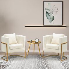 two white chairs sitting next to each other on top of a rug in front of a wall