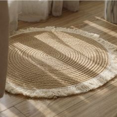 a round rug with fringes on the floor