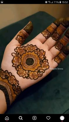 the hand is decorated with henna on it