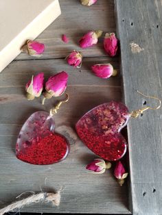 Beautiful natural rose petals in heart resin earrings. Half heart earrings with half rose petals, half glittering red.. Hues of amber red paired with golden metals make these natural earrings boldly colorful. Ruby red earrings with handmade resin heart pendants with real dried rose petals ♥ Be sure to check out the RED EARRINGS section at EarringsbyLCreations for all beautiful red colored earrings available! https://www.etsy.com/shop/EarringsByLCreations?section_id=28420977 Made with quality mat Heart-shaped Earrings For Mother's Day, Resin Heart Earrings For Gifts, Valentine's Day Heart-shaped Flower Earrings For Pierced Ears, Pink Heart-shaped Flower Earrings For Gift, Pink Heart-shaped Flower Earrings As Gift, Handmade Drop Flower Earrings For Valentine's Day, Rose Earrings For Valentine's Day, Rose Valentine's Day Earrings Gift, Valentine's Day Gift Rose Flower Earrings