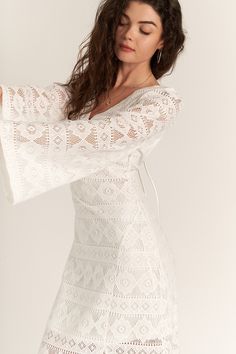 Lily Lace Long Sleeve Maxi Dress Experience the epitome of elegance with the Lily Lace Long Sleeve Maxi Dress in white. This stunning dress is perfect for vacation getaways, offering a graceful and sophisticated look for seaside dinners and sunset strolls. Elegant Design: The intricate lace detailing and long sleeves create a timeless and sophisticated appearance, ideal for elegant evenings and special occasions. Lightweight Fabric: Made from 100% polyester, this dress ensures comfort and ease, making it perfect for warm-weather vacations. Versatile Style: Pair with strappy sandals for a relaxed beach look or elevate it with heels for a chic dinner outfit. Relaxed Fit: Designed to provide comfort and elegance, this maxi dress allows you to move with ease while looking effortlessly stylish. Chic V-neck Dress For Beach Wedding, Breezy White V-neck Mini Dress, Elegant Beach Season Midi Dress, Elegant Midi Dress For Beach Season, Chic Dresses For Brunch On Vacation, Elegant V-neck Vacation Dresses, Elegant Beach Season Midi Dress For Vacation, Elegant Midi Dress For Beach Season Vacation, Elegant Midi Dress For Beach Vacation