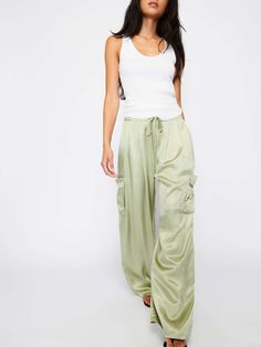 Looks like going out. Feels like staying in. Wide leg cargo pants in luxe Hammered Satin with a drawstring waist, gathered pleats, side pockets with patch pockets below, and a flattering, relaxed fit. (This one comes in Olive Oil.) | Women's Romeo Pant in Olive Oil | Ethical Essentials Loosely Fitted Parachute Pants With Cargo Pockets For Loungewear, Wide-leg Parachute Pants With Cargo Pockets For Loungewear, Spring Cargo Pocket Lounge Pants, Spring Utility Cargo Pants For Loungewear, Spring Loungewear Pants With Cargo Pockets, Utility Cargo Pants For Spring Loungewear, Spring Parachute Pants With Cargo Pockets For Loungewear, Spring Loungewear Parachute Pants With Side Pockets, Loungewear Cargo Style Parachute Trousers