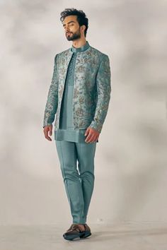 Ombre chateau grey short jacket with hand embroidery. Paired with pintuck detail kurta and tapered trousers.
Component: 3
Pattern: Embroidered
Type Of Work: Floral
Neckline: Open
Sleeve Type: Long
Fabric: Linen Silk
Color: Grey
Other Details: 
Pintuck kurta
Floral embroidery
Occasion: Sangeet,Wedding - Aza Fashions Indowestern Outfits For Men, Jatin Malik, Indian Wedding Clothes For Men, Sherwani For Men Wedding, Wedding Kurta, Wedding Kurta For Men, Groom Dress Men, Kids Ethnic Wear, Gents Kurta