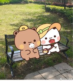 two teddy bears are sitting on a park bench