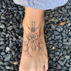 a person has a tattoo on their foot