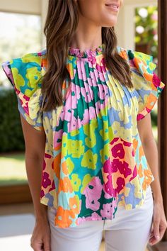 Features: Ruffled Sheer: Opaque Stretch: No stretch Material composition: 100% polyester Care instructions: Machine wash cold. Tumble dry low. Imported Size US Bust Shoulder Sleeve Length Top Length S 4 39.8 12.8 4.9 23.6 M 6/8 42.1 13.4 4.9 24.4 L 10/12 44.5 14 4.9 25.2 XL 14/16 47.6 14.8 4.9 26 Flutter Sleeve Blouse, Cap Sleeve Blouse, Stand Neck, Cap Sleeves Blouse, Pleated Sleeves, Pleated Blouse, Stylish Blouse, Floral Blouse, Abstract Print