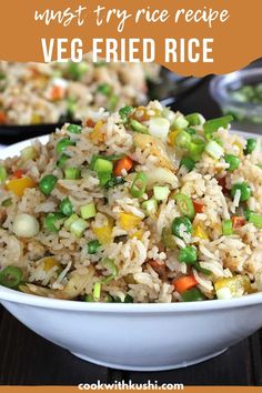 a white bowl filled with rice and veggies on top of a wooden table