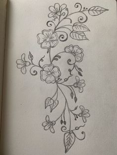 a drawing of flowers and leaves on a piece of paper with pencil in the middle