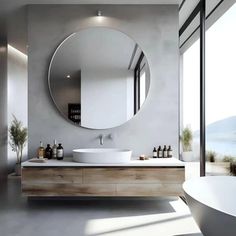 a bathroom with a large round mirror above the sink