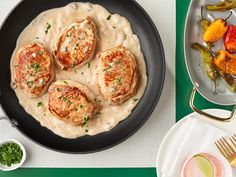 three different types of food are shown on the table, including meat patties and mashed potatoes