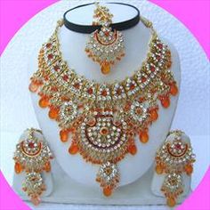 Gold Rodium Polish Orange color Necklace in Metal Alloy studded with CZ Diamond, Kundan Festive Round Jewelry With Rhinestones, Festive Round Rhinestone Jewelry, Orange Jeweled Jewelry As Gift, Orange Jeweled Jewelry For Gift, Luxury Orange Jeweled Jewelry As Gift, Maroon Necklace, Ethnic Wedding, Orange Necklace, Color Necklace