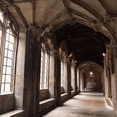 an old building with stone floors and arched windows