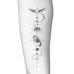 a black and white photo of a person's leg with an abstract tattoo design on it