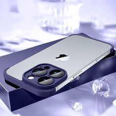 an iphone case sitting on top of a table next to some ice cubes and water