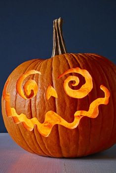 a carved pumpkin sitting on top of a table