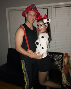 a man and woman dressed up in costumes