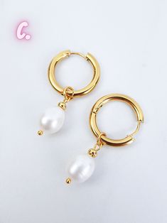 Huggie hoop pearl Earrings are one of the must have jewelry pieces this spring and summer season! We have traditional gold pearl hoops and some more unique hoops in silver and black color and beautiful black pearls too! Please choose the option from the drop-down menu: A. Medium hoop (0.66 inch) with round pearl B. Medium hoop (0.66 inch) with irregular pearl C. Large hoop (0.83 inch) with thick oval hoop D. Large hoop (0.83 inch) with long oval hoop E. Small hoop (0.5 inch) with small pearl F. Pearl Baroque, Thick Hoop Earrings, Earrings Gold Hoop, Black Pearls, Baroque Pearl Earrings, Hoop Earrings Gold, Pearl Hoop Earrings, Huggie Earrings, Huggie Hoop Earrings