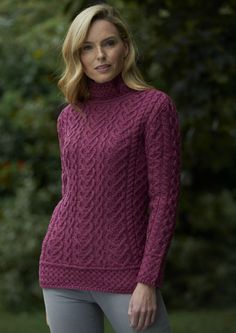 The luxuriously soft Aran cable sweater is knitted with a mix of Aran Cable Stitches that makes a charming heart design. An elegant and stylish piece of Irish knitwear. 100% Super Soft Merino Wool Made in Ireland Aran Dress, Aran Stitches, Irish Knitwear, Polo Neck Sweater, Scottish Clothing, Winter Wear Women, Irish Sweater, Cowl Neck Sweater Dress, Hearts Design