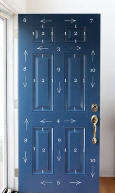 a blue door with numbers and arrows painted on it