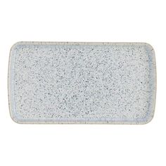 a rectangular blue and white platter with speckles