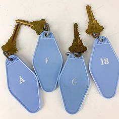 "Great lot of 4 vintage hotel motel keys / key fobs. Blue/lavender plastic with keys. Love the retro vibe. Blank backs - would be great with personal branding or fun sayings. A F G and 18.  Good shape. Minor wear. Please see all photos for condition and wear as they are a part of the description.  Approximately 3.5x1.75\" for fob.  Great addition to your vintage home decor and brass collection. Tons of vintage items for sale.  Items are cross posted - if you love it, bid or buy, it might be gone tomorrow!   For other great vintage finds like this - please follow along on IG @goodsresurrected!" Blue Hotel Room, Hotel Items, Vintage Hotel Keychain, Hotel Room Key, Vintage Hotel, Fun Sayings, Valley Girl, Vintage Hotels, Hotel Branding