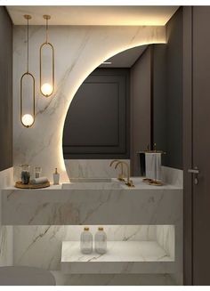 a bathroom with marble counter tops and gold fixtures on the wall, along with two sinks