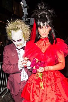 a man and woman dressed up in costumes