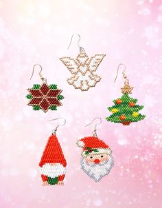 cross stitch christmas ornament kits on pink background with snowflakes and stars