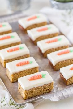 carrot cake bars with frosting on a tray