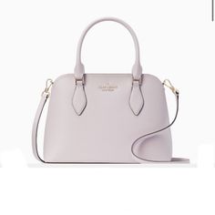 Product Details 7.87"H X 10.62"W X 4.12"D Handle Drop: 5" Strap Drop: 22" Refined Grain Leather Metal Pinmount Logo Unlined Interior: Back Slip Pocket Drop In Top Zip Closure Dust Bag Not Included Imported - Lilac Moon Purple Kate Spade Purse, Kate Spade Satchel, Yellow Handbag, Satchel Tote, Kate Spade Purse, Satchel Purse, Kate Spade Handbags, Drop In, Kate Spade Bag