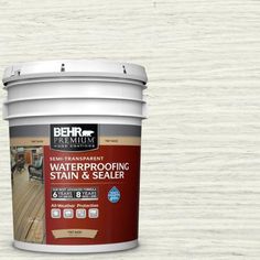 a bucket of waterproofing stain and sealer sitting on top of a wooden floor