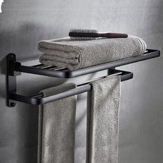 a towel rack with two towels hanging on it