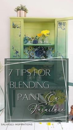 a green painted cabinet with flowers and vases on top, in front of the words 7 tips for blending paint on furniture