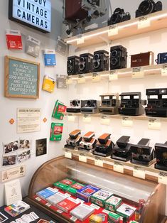 there are many cameras on display in the store