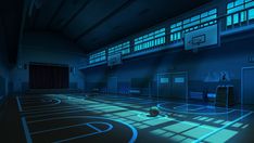 an indoor basketball court is lit up with blue lights and the ball on the floor