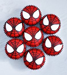 spiderman cupcakes with white frosting on top