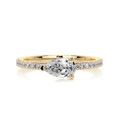 a rose gold engagement ring with a pear shaped diamond in the center and side stones