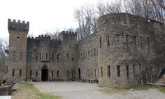 an old castle like building in the woods