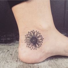 a sunflower tattoo on the ankle is shown in an instagramtion post by @ beautypicc com